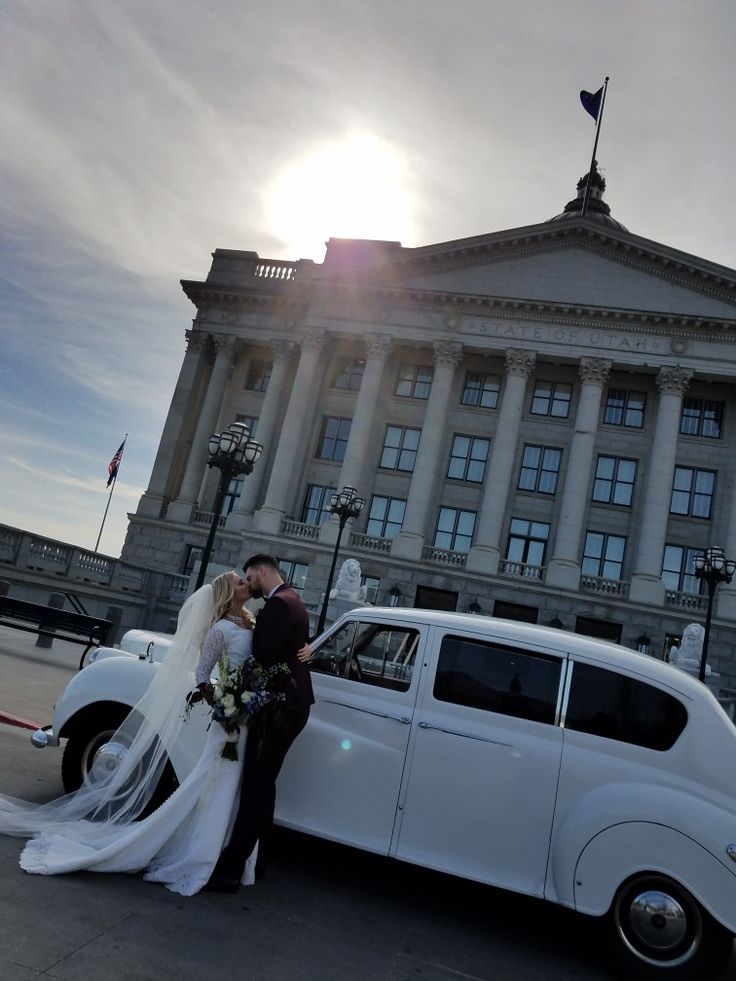 Bride and groom kissing beside Princess Ivy at the Utah State Capitol
