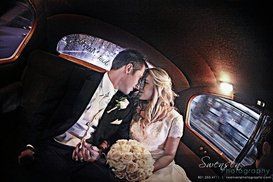 Newlyweds riding in the back seat of Princess Ivy